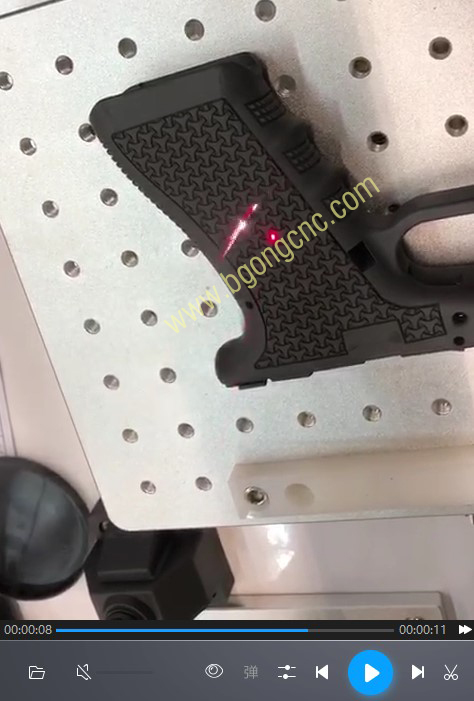 Laser stippling engraving on gun.jpg